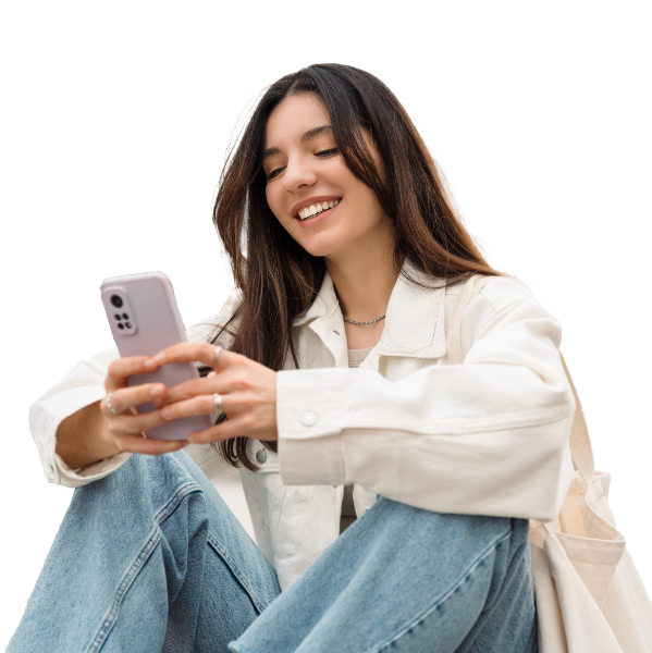 woman smiling looking at phone