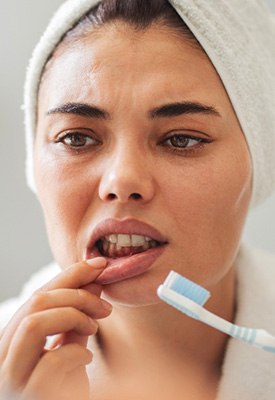 Patient looking concerned at their gums